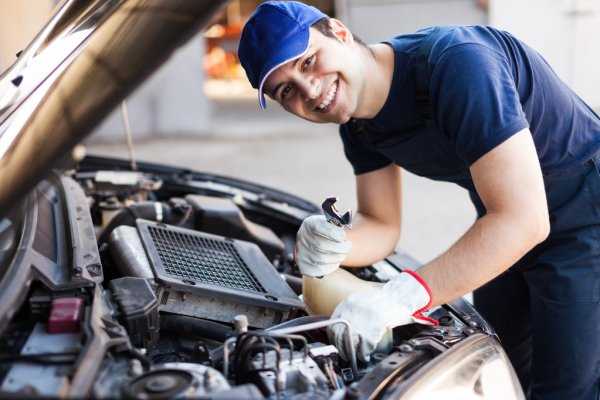 Mechanic working on car engine | Stock Images Page | Everypixel